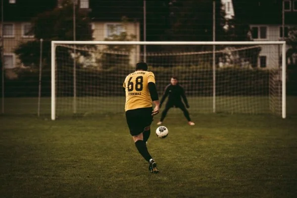 football player header in penalty area